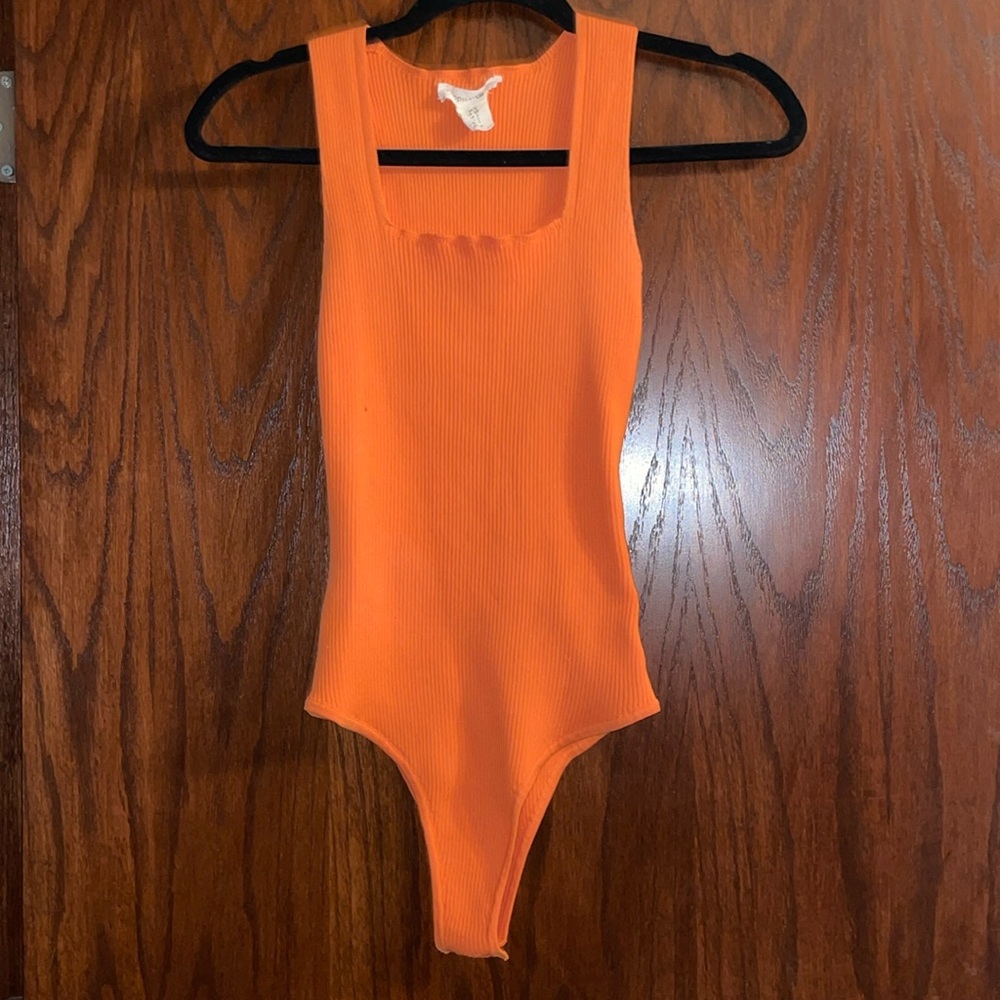 Orange body suit